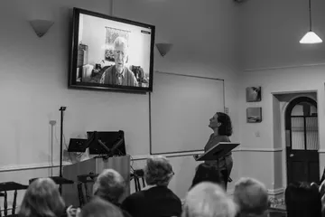 Dr. Bethan Willis interviewing Nicholas Wolterstorff, who joins live on screen from the US.