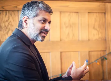 A speaker sharing a thought during the Cornell faculty retreat.